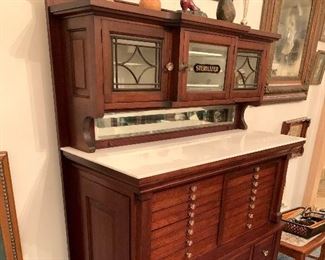 Stunning dental cabinet with marble top, original sanitizer decal, and tools. Pictures do not do it justice