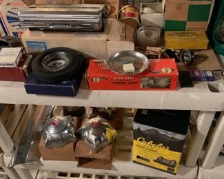 Multiple tachometers for 1950s and 60s cars, Kleenex holder, license plate brackets, hubcaps