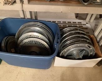 Rambler, Chevy SS, Cadillac, Chevrolet, and other assorted sets of hubcaps