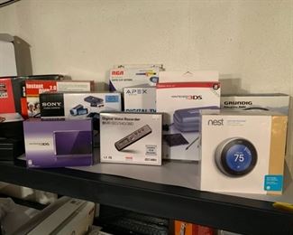 Nest thermostat, digital voice recorder, Nintendo 3DS, Sony multi function DVD recorder, digital TV converter, digital FM antenna