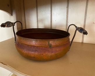 Copper accent bowl with ceramic handles
$20