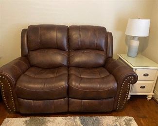 Faux leather love seat from Rooms to Go
66 1/2 x 37” x 18 1/2” 
$375