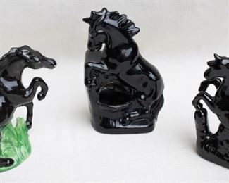 $25 each Center: Rearing black ceramic horse planter  | W: 6" | H: 9" | D: 3.5"
$25 each Right: Rearing black ceramic horse.  W: 5.5" | H: 7.5" | D: 2.5"
Left: Prancing black ceramic horse on green-glazed foliage.  W: 7" | H: 7.5" | D: 3" [Bin 43]