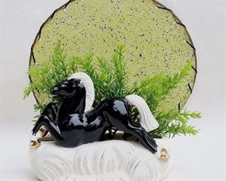 $40 Black/white ceramic planter, horse tableau with plastic foliage & speckled disk.  W: 9.5" | H: 10" | D: 4.5" [Bin 41] 