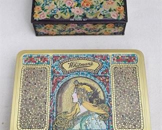 $15 Upper: Vintage rectangular candy tin, floral design, hinged lid, Schrafft's chocolates.  L: 8" | W: 5" | H: 2.5" 
$30 Lower SOLD! : Rectangular candy tin, art nouveau design, Whitman's Salmagundi.  L: 10" | W: 8.5" | H: 1.5" [Props] 