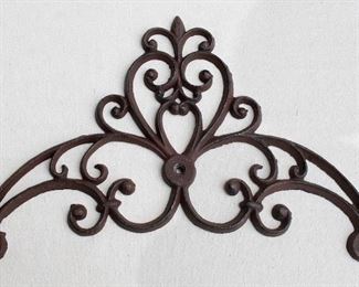 $40 Wall-mounted dark cast metal scrollwork, 3 holes for hanging.  W: 15" | H: 10" | D: 0.5" [Bin 37] 