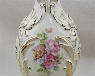 $25 Dresden-style ceramic vase, cream w/ gold, pink roses & foliage on both sides. Paul Gifts, #8817.  W: 6" | H: 12.5" | D: 5"  AS IS : one crack in finish [Props] 