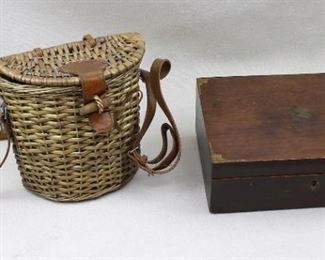 $30 Left: Fishing creel, wicker, leather/wood clasp, leather strap.  W: 8" | H: 7.5" | D: 4.5"
$30  Right: Vintage mahogany box, faded gilded decoration on outside, painted flowers on inside of hinged lid, contains bandages.  L: 10" | W: 7" | H:  3.5" [Bin 36] 