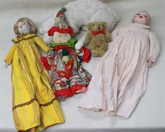 LOT $45 - Girl doll, bisque head & hands, blond hair, painted eyes, long dress w/ mustard/brown stripes, bertha collar.  L: 17" 
- Clown doll, fabric, embroidered face.  L: 17"  
- White plush lamb w/ large black plastic eyes, long legs, leather cloven hooves.  L: 15.5"  
- Brown plush teddy bear, red bow around neck.  L: 6"
- Baby doll, bisque head & hands, painted hair, glass eyes, pink patterned long cotton dress.  L: 15" [Bin 32] 
