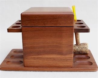 $25 Pipe stand for 6 pipes, mahogany wood w/ felt on bottom, box for tobacco, comes w/ tobacco & corncob pipe.  W: 1" | H: 6" | D: 5.5" [Bin 26] 