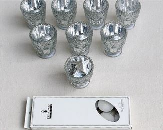 $25 Set of 8 votive candle holders, pressed glass w/ interior silver wash, box of tea lights included.  In box, made in China.  H: 3" | diameter: 3" [Bin 26] 