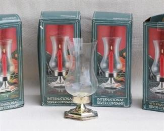 $30 Set of 4 hurricane candlesticks, hexagonal silverplate base, plain hurricane glass. International Silver, in box, made in China.  W: 5" | H: 9.5" | D: 5" [Bin 26] 