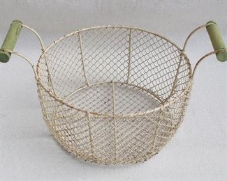 $30 Wire basket painted cream, 2 green wooden handles.  W: 15" | H: 8.5" | diameter: 11" [Bin 29] 