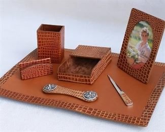 $75 - Desk set: faux alligator leather, 7 pieces (blotter, pencil holder, letter holder, horizontal paper holder, letter opener, picture frame, paper weight). Brand new, in box.   Blotter dimensions:  19x13". [Box27]