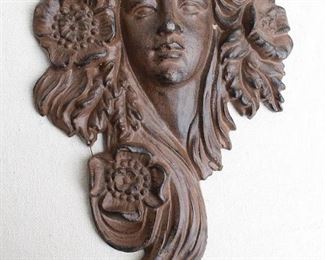 $60 - Cast metal female head, Art Nouveau style, hanger on back, finish like cast iron that needs blacking.  W: 8" | H: 12.5" | D: 2.5" [Bin 24] 