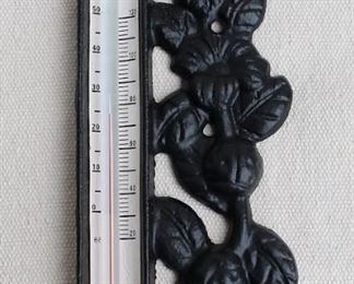 $45 - Black cast metal wall thermometer, floral decoration, 2 holes for hanging, alcohol thermometer in Centigrade and Fahrenheit (-20F to 120F).  H: 7"| W: 3"W| D: 0.5"  [Bin 24]