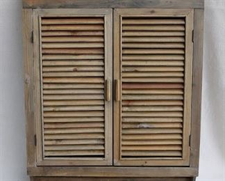 $120 - Wall cabinet, natural wood, 3 shelves, louvred doors w/ magnetic closures, 4 pegs below for hanging items.  W: 25" | H: 32" | D: 5"