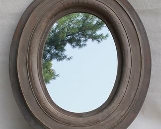 $24 - Mirror with oval frame of lightweight wood, painted taupe finish, 2 metal hangers.  W: 30" | H: 36" | D: 2.5" | mirror diameter:  15.5x21.5"