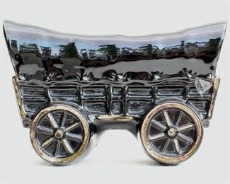 $24- Planter shaped like a covered wagon, black-glazed ceramic picked out in gold.  L: 10" | W: 4" | H: 5.5" [Bin 19] 