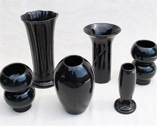 $60 - LOT Clockwise from upper left: Tall, fluted, black-glazed ceramic vase.  H: 10" | diameter: 5" 
- Tall, flared, black-glazed ceramic vase.  H: 7.5" | diameter: 5" 
- Set of 2 black-glazed ceramic vases shaped like two globes on top of each other.  H: 5.5" | diameter: 4.5"
- Black-glazed ceramic bud vase.  H: 6.5" | diameter: 3"
- Black-glazed ceramic vase, rounded, opening on top is small.  H: 7" |diameter: 5" [Bin 19] 
