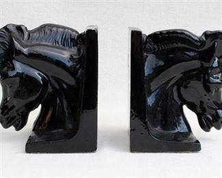 $30 - Pair of black-glazed ceramic horsehead bookends.  W: 6" | H: 76.5" [Bin 19] 