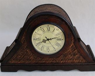 $20 - Mantel clock, dark wood and dark-stained woven cane, dial has Roman numerals & ornate hands, Three Hands Corp., takes 1 AAA battery.  W: 19" | H: 12.5" | D: 6"