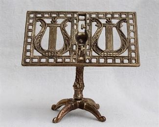 $24 - Cast brass pedestal easel, double lyre design.  W: 6" | H: 5.5" | D: 3.5" [Bin 15] 