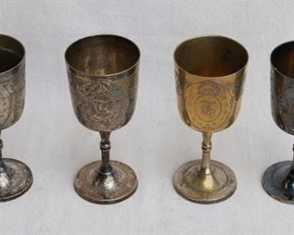 $60 - Set of 7 incised stemmed metal goblets, gold/silver, "T" monogram.  Each H: 6.5" | cup diameter: 3" [Bin 15] 