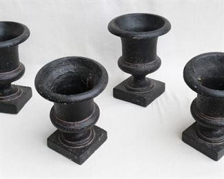 $30 - Set of 4 black classical-style urns, composite material, base 6" square.  AS IS: 1 has chipped top edge.  W: 9" | H: 12" | urn diameter: 9" [Bin 14] 