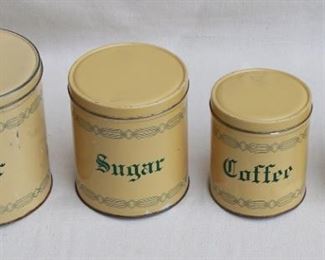 $30 - Vintage labeled canister set of 4 canisters, cream & green.  H: 7.5" | diameter of largest: 7" [Bin 12C] 