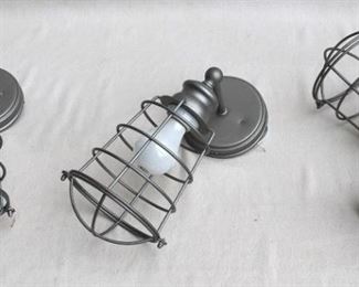 $36 - LOT of 3 wall-mounted metal light fixtures, pewter color, cage for bulb, new & never used.  W: 6.5" | H: 14" | D: 7.5" | diameter of base: 5" [Bin 11A (dup)] 