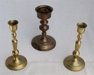 $30 - LOT Center: Brass candlestick w/ drip catcher.  H: 6" 
Right and Left: Pair of brass candlesticks.  H: 6.5" [Bin 8B] 
