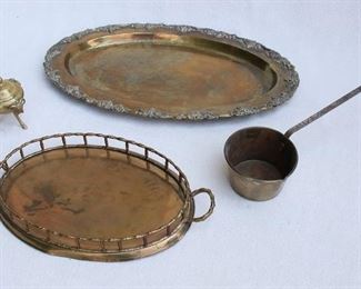 $40 - LOT- Cast brass platter, edged w/ grapevines in bas relief.  L: 20" | W: 13.5" | H: 1" 
- Brass gallery tray, 2 handles.  L: 15" | W: 8.5" | H: 2"    
$40 - LOT - Brass dipper w/ 9" handle.  H: 2.5" | cup diameter: 4.5"   
- Covered brass pot, 3 cast ram's heads/feet applied.  W: 3.5" | H: 4.5" [Bin 7C]