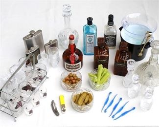 $75 - LOT of bar supplies: liquor bottles, decanters, flasks; ice buckets w/ ice; openers, citrus peelers; glass dishes of olives, pickles, celery  [Bin 5a] 