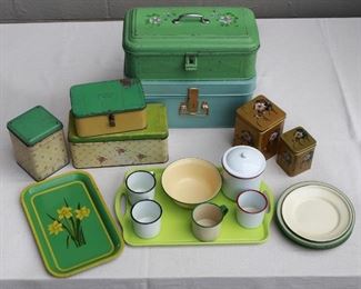 $50 - Enamelware containers, most cream & green: enameled tray w/ daffodils ($x); patterned cannister ($x); patterned biscuit tin ($x); latched Lunch Box ($x); bread box w/ painted flowers ($x); large latched tin w/ handles ($x); set of 4 enameled dinner plates ($x); set of 3 enameled salad plates ($x); set of 6 nesting tea caddies, Asian pattern ($x); set of 3 handled mugs ($x); handleless mug ($x); green plastic tray ($x)  [Bin 2] 