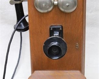 $75 - Prop telephone,  oak box, 2 bells, speaker, earpiece on cord, shelf for writing, 2 holes for hanging.  W: 9.5" | H: 21" | D: 15" [Props] 