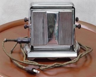 $30 - Early electric toaster w/ original cord, manual, 2-slice, silver & black, Manning-Bowman & Co., Meriden CT.  W: 7.5" | H: 7.5" | D: 5.5" | cord length: 72" [Props] 