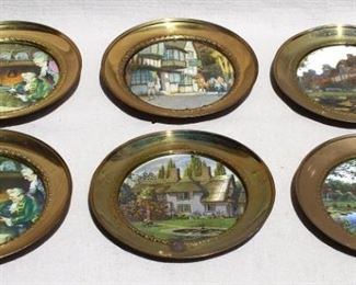 $55 - Set of 6 picture plates: English scenes in round brass frames, self-hangers.  W: 7.5" | D: 0.5"  [Props] 