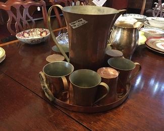 Copper pitcher and cups in pretzel-handled tray