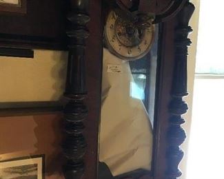 Antique wall clock--pictured upside down as we didn't want to hang it.  Great piece needing TLC