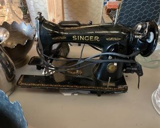 #41	singer vintage sewing machine as is plug 	 $30.00 
