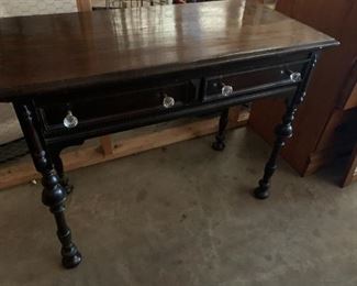 #70	black 2 drawer desk with glass knob 36x18x30 as is wiggly	 $75.00 
