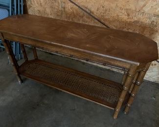 #73	sofa table with wicker bottom with bamboo looking legs 52x16x26 as is top	 $45.00 
