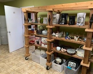 #166	rough wood double shelf on wheels that fold on top for easy moving  88x26x78	 $300.00 
