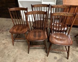 #210	5 wood dining chairs with design on the back 	 $150.00 
