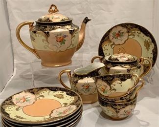 $125 - Handpainted Japanese 13-Pc Tea Set: teapot, creamer, sugar bowl, four teacups and six dessert plates. Teapot is 7.5" H; sugar bowl is 6" H, creamer is 4" H ; dessert plates are 7.25"; cups are 2.25" H