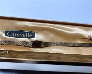 Caravelle 10k gold watch with stainless steel backing