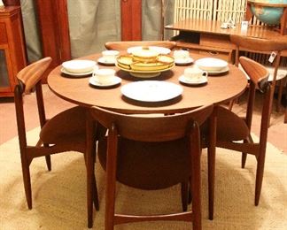 Dining set with expandable butterfly leaf.