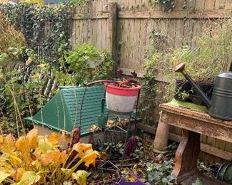 Garden table, pots, watering can.