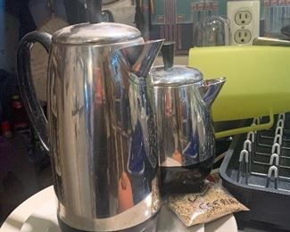 Several percolator coffee pots.